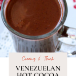 A glass mug of hot chocolate.
