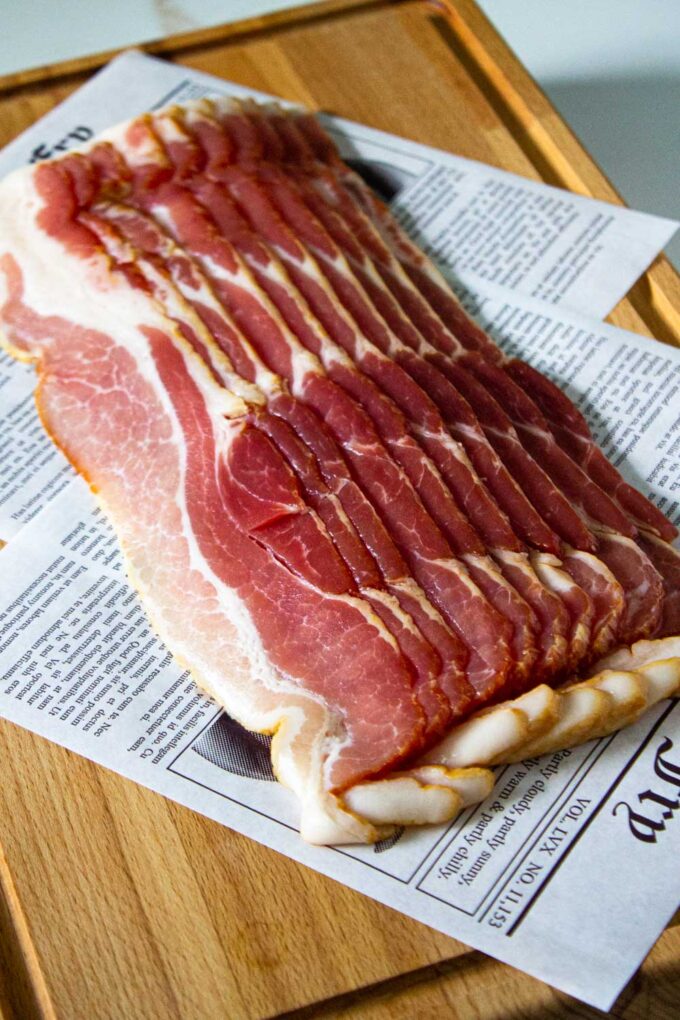 View a slack of uncooked bacon.