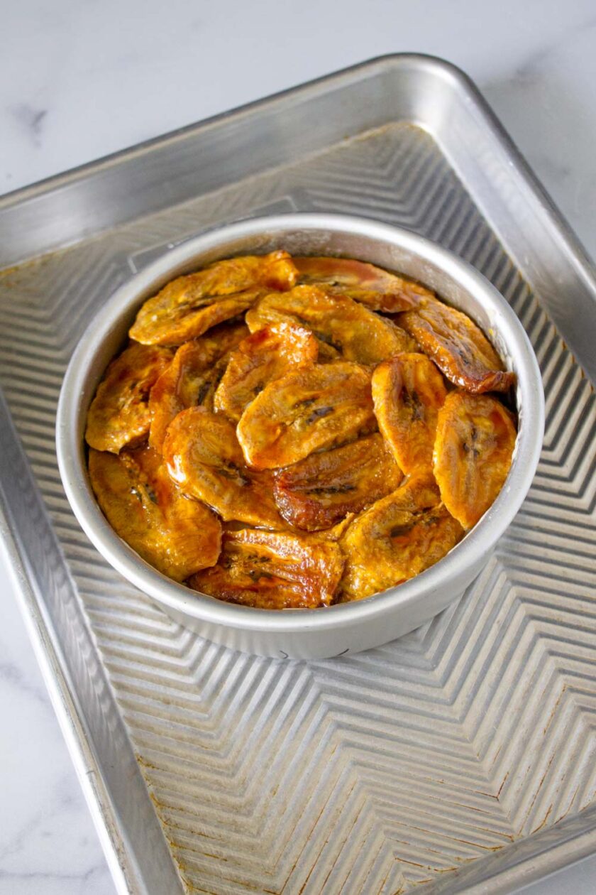 A torta de plátano venezolana, made in cake pan, placed on baking try before getting into the oven.