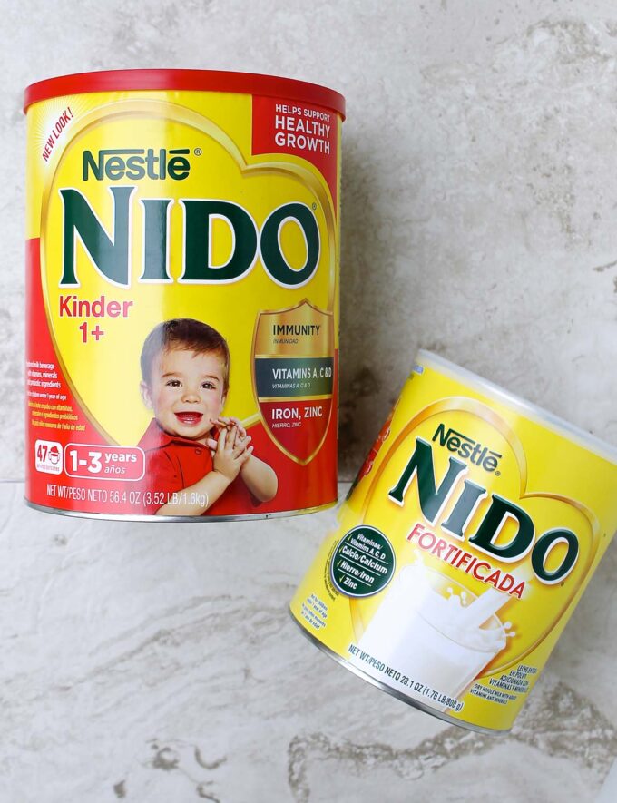 Two cans of NIDO powder milk to make papitas de leche, by enrilemoine.