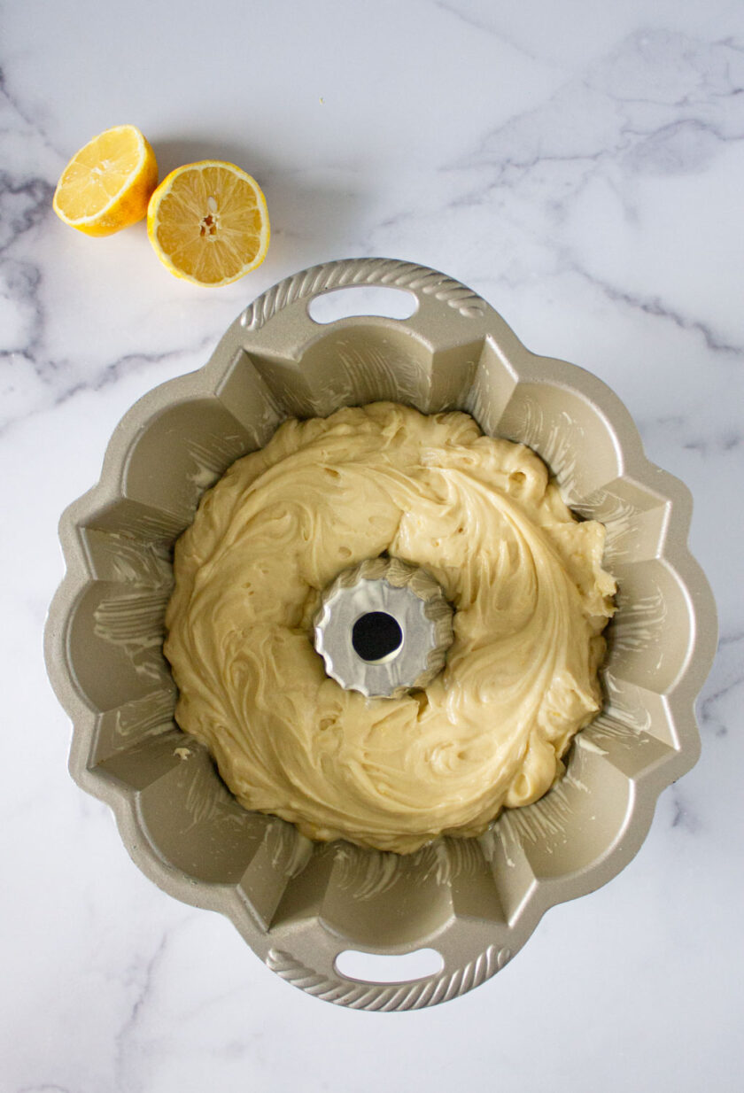 A bundt pan with lemon pound cake batter, by enrilemoine.