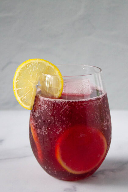 Red sangria with lemon wedge and Spanish summer red wine recipe.