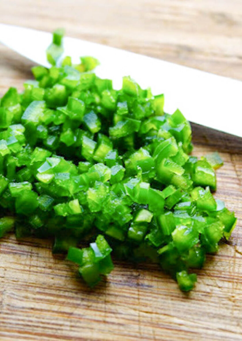 Chopped jalapeños on a cutting board, by enrilemoine.