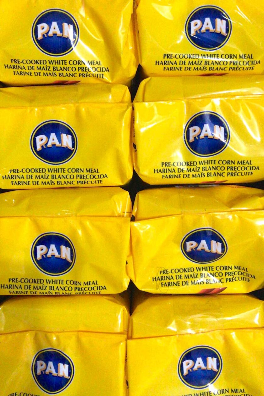 A stack of yellow packages of Harina PAN, by enrilemoine