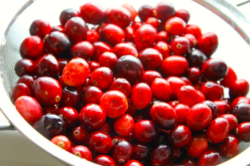 Fresh cranberries in a colander.