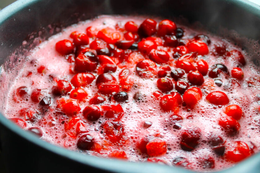 A pot with cranberries boiling.