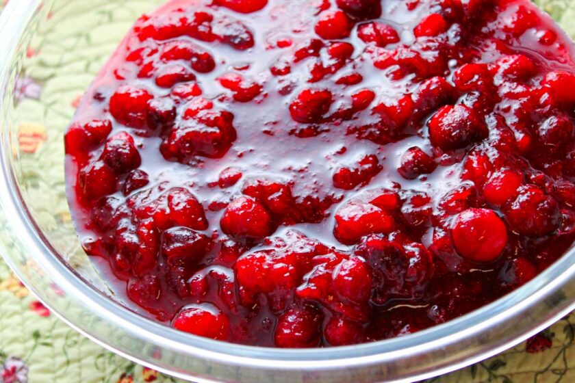A glass bowl with homemade cranberry sauce.
