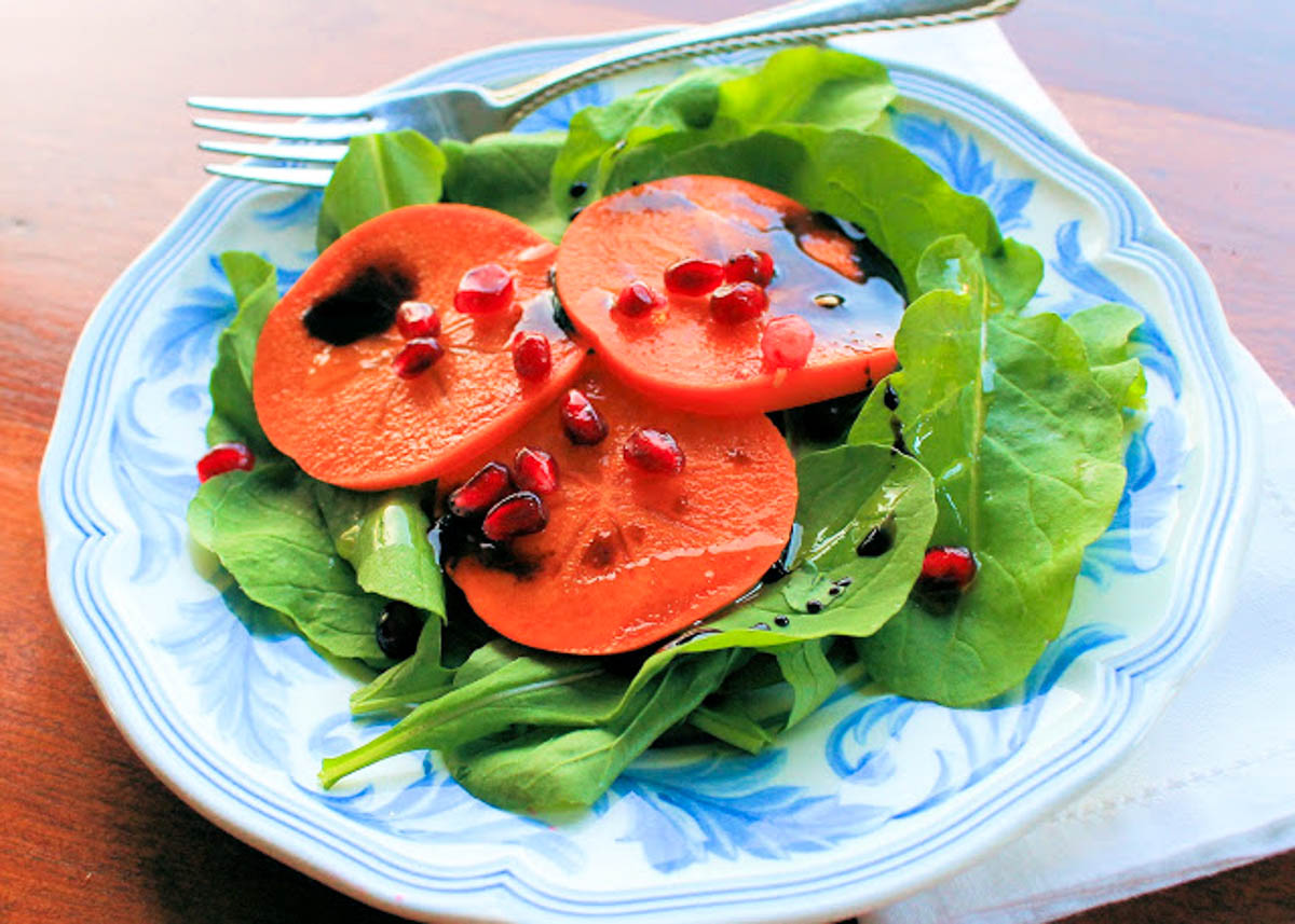 Persimmon, arugula and pomegranate salad.