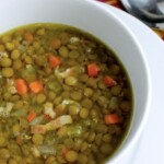 A cozy bowl of lentil soup on a table.