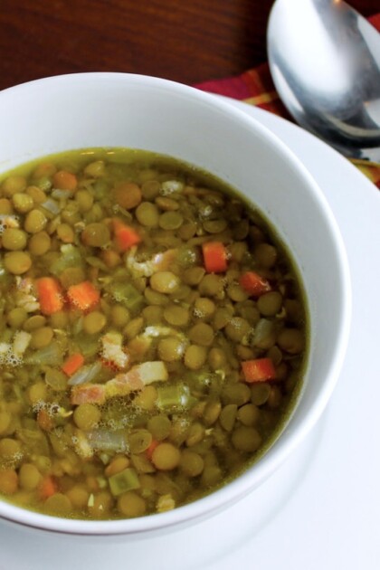 A cozy bowl of lentil soup on a table.