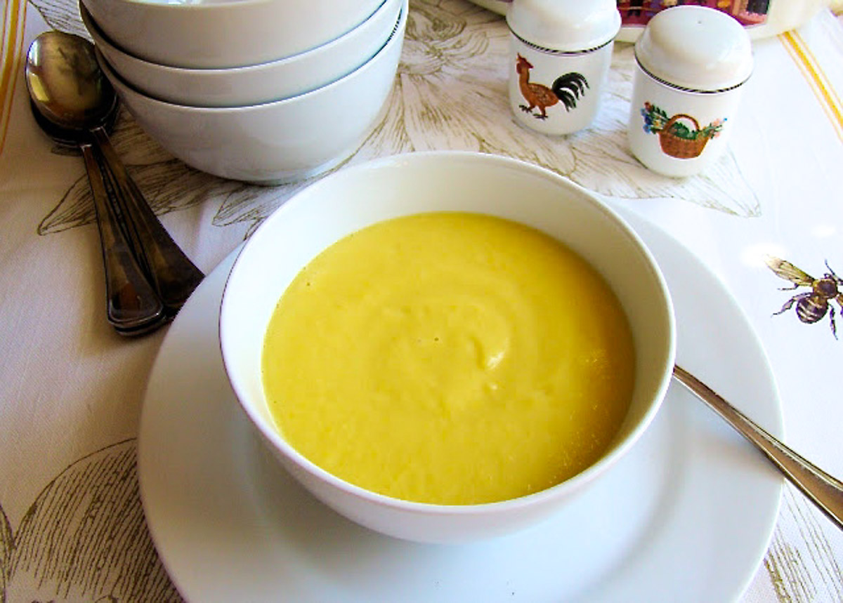 Yellow squash soup in a bowl.