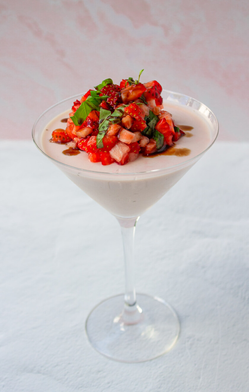 Strawberry panna cotta served on a martini glass.