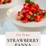 A martini glass with strawberry panna cotta, topped with fresh strawberries, basil and balsamic glaze.
