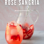 A jug and a glass of prosecco rose sangria with sliced strawberries, captioned with a recipe title and website source.