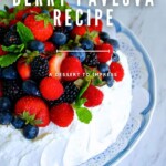 A platter featuring a berry pavlova topped with fresh strawberries, blueberries, blackberries, raspberries, and mint leaves, with the text "Hassle-Free Berry Pavlova Recipe: A Dessert to Impress.