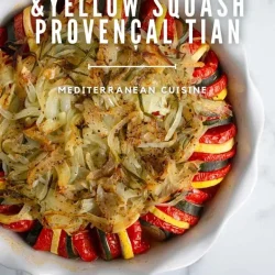Sliced tomatoes, zucchini, and yellow squash are layered in a round dish with herbs and onions for this Tomato Zucchini & Yellow Squash Provençal Tian Recipe. Wondering what is a tian? Discover the ingredients for a perfect Provençal tian in this dish.