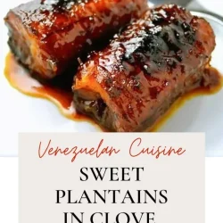 Two pieces of sweet plantains glazed with clove syrup on a white plate, accompanied by a fork. Text reads: “Venezuelan Cuisine: Sweet Plantains in Clove Syrup.”.