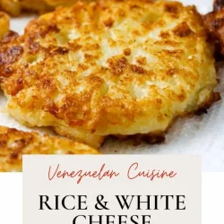 Golden-brown rice and white cheese fritters aka torticas de arroz, on a tray.