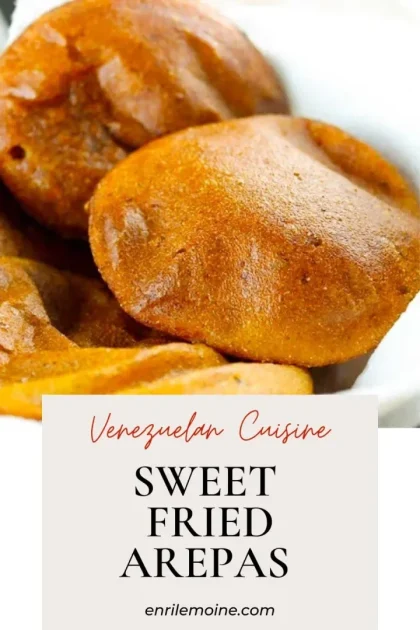 Close-up of golden brown sweet fried arepas on a white plate with text: Venezuelan Cuisine, Sweet Fried Arepas.
