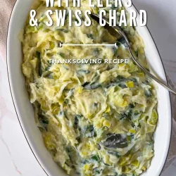 Oval dish of mashed potatoes with leek and chard served with a spoon, labeled as a Thanksgiving recipe.