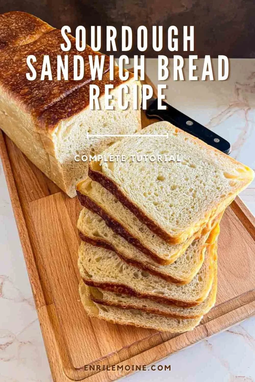 Sliced sandwich sourdough bread on a wooden board with a knife; text overlay reads "Sourdough Sandwich Bread Recipe".
