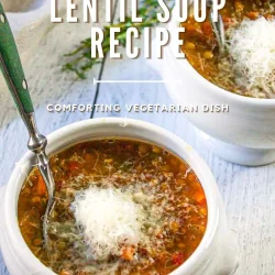 Two white bowls of Italian-Style Lentil Soup topped with grated cheese, each with a spoon, on a wooden table.