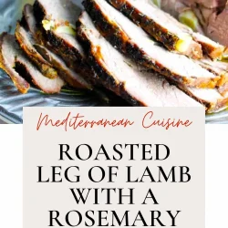 Roasted leg of lamb with a rosemary crust, sliced and served on a pewter plate.