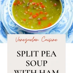 Split pea soup with han and carrtos in a white and blue bowl.