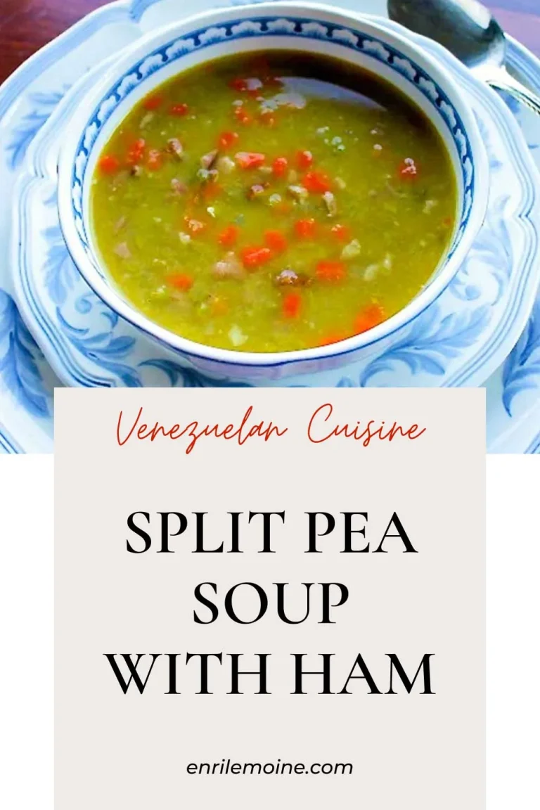 Split pea soup with han and carrtos in a white and blue bowl.