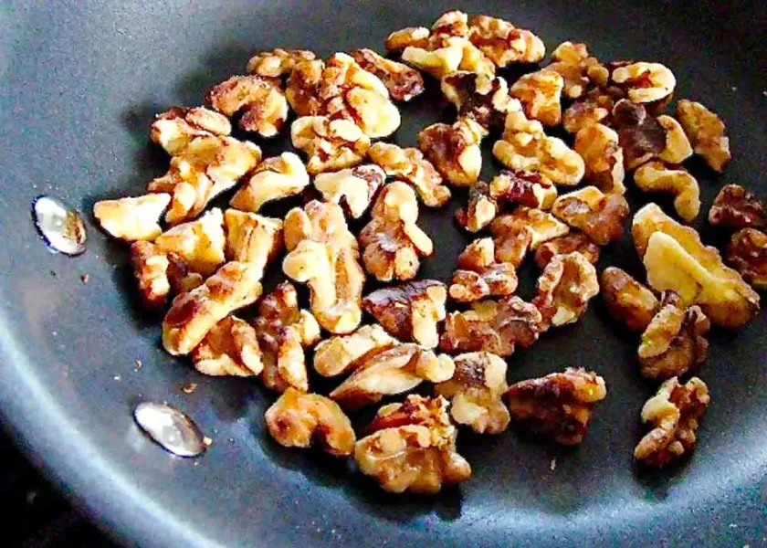 Walnut halves on a pan.
