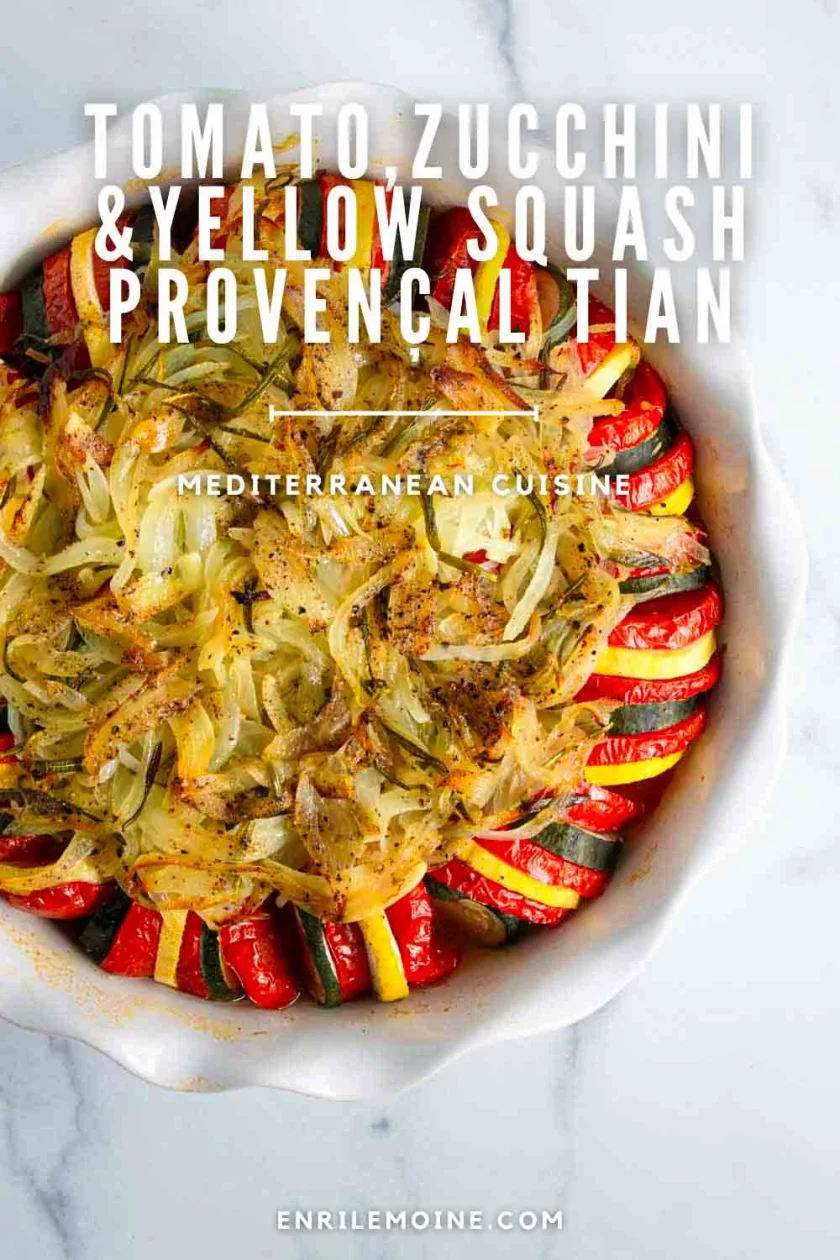 A round dish filled with neatly arranged slices of tomato, zucchini, and yellow squash, topped with cooked onions and herbs. Text overlay describes it as a Provençal tian.